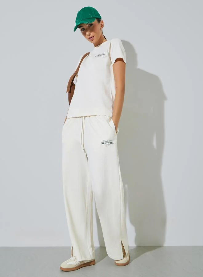 ستايلي Cream Text Print Cotton Blend T-Shirt and Joggers Co-ord Set