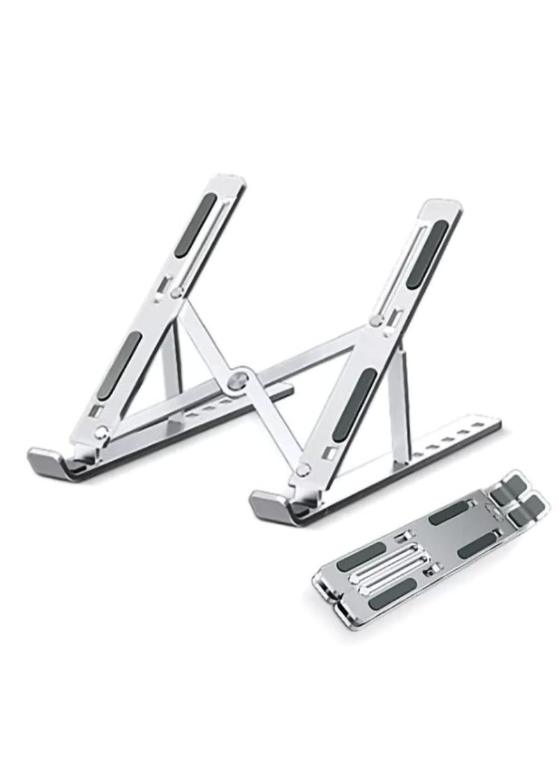 A durable and lightweight laptop stand made of aluminum. It folds and adjusts easily for comfortable use. It stays secure on the desk and is non-slip. - Image 1