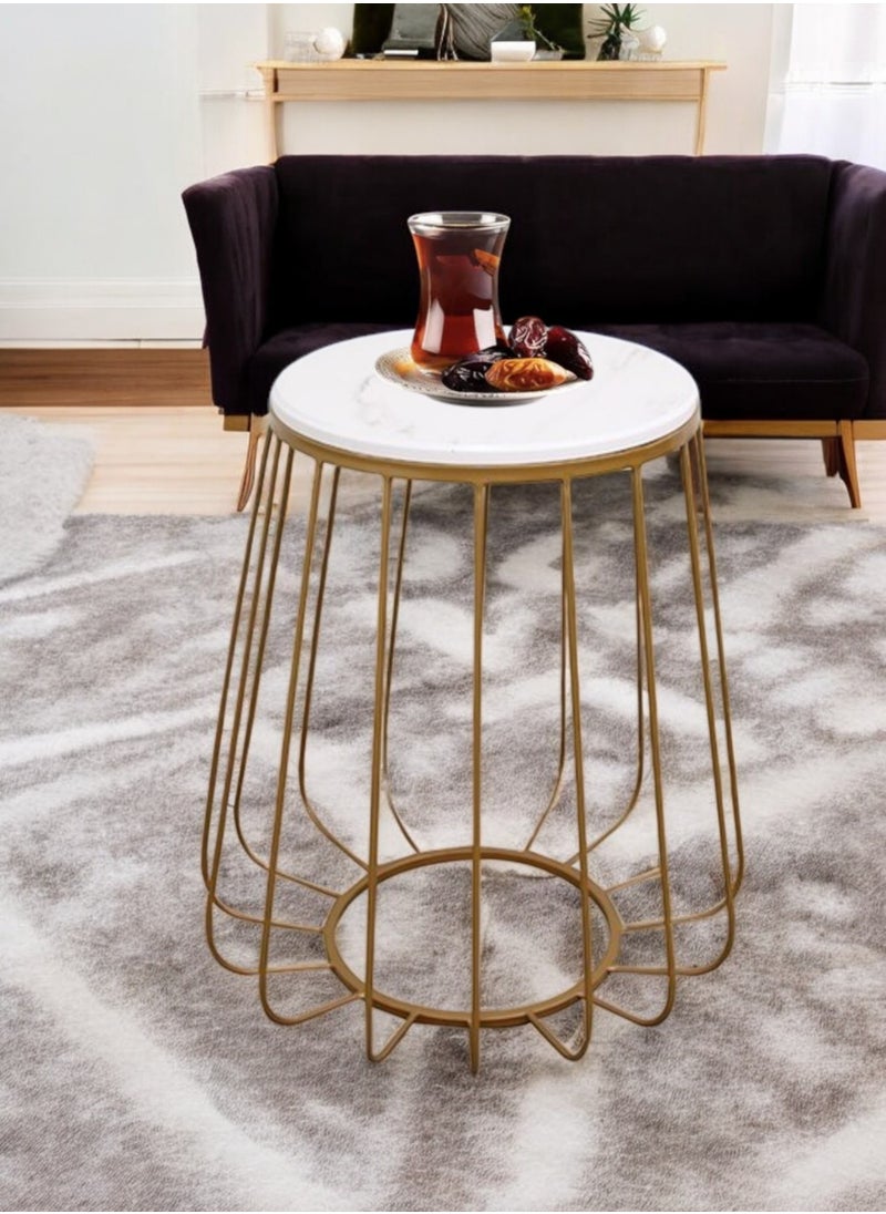 A stunning serving table with an elegant round design and a shiny gold finish, made of wood with a luxurious marble look. The table comes with perfect dimensions: 40 cm wide, 40 cm long and 60 cm high, making it an ideal choice for use as a coffee and tea table. In addition, this unique table is ideal for displaying artwork, decorations and books, adding a touch of luxury to any space.