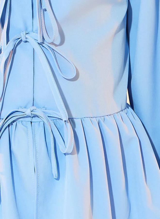 تايك تو Solid Long Sleeve Ruffled Hem Shirt with Tie Up Detail
