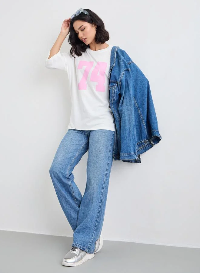 ستايلي Styli Women Off White Exaggerated Shoulder Graphic Oversized T-Shirt
