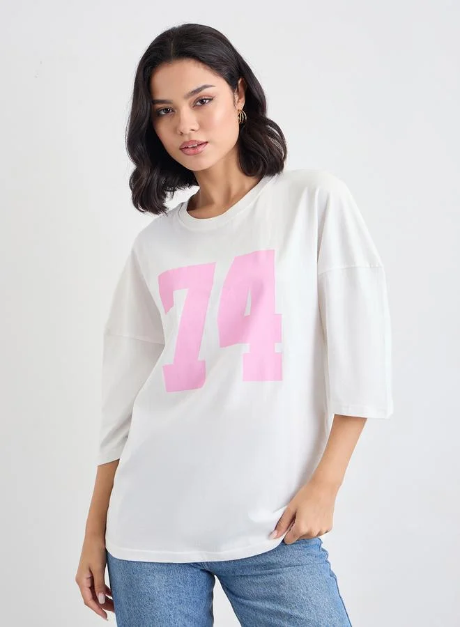 ستايلي Styli Women Off White Exaggerated Shoulder Graphic Oversized T-Shirt