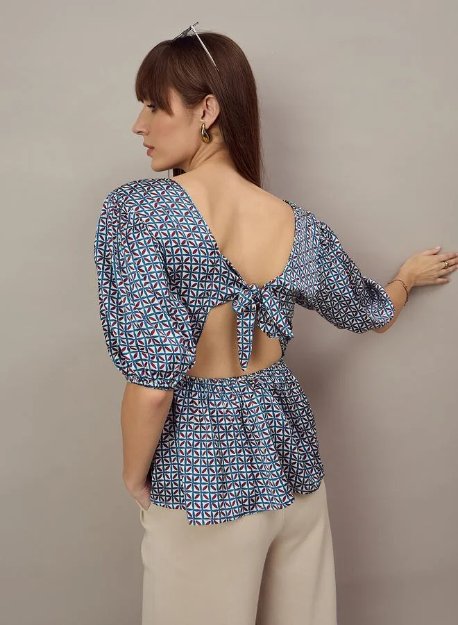 Kuwarii Geometric Print Peplum Top with Back-Tie