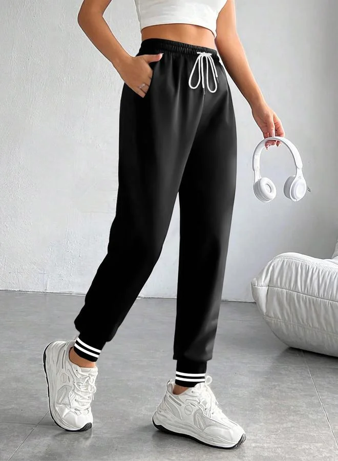 تايك تو بنطلون رياضي أسود سادة بأساور