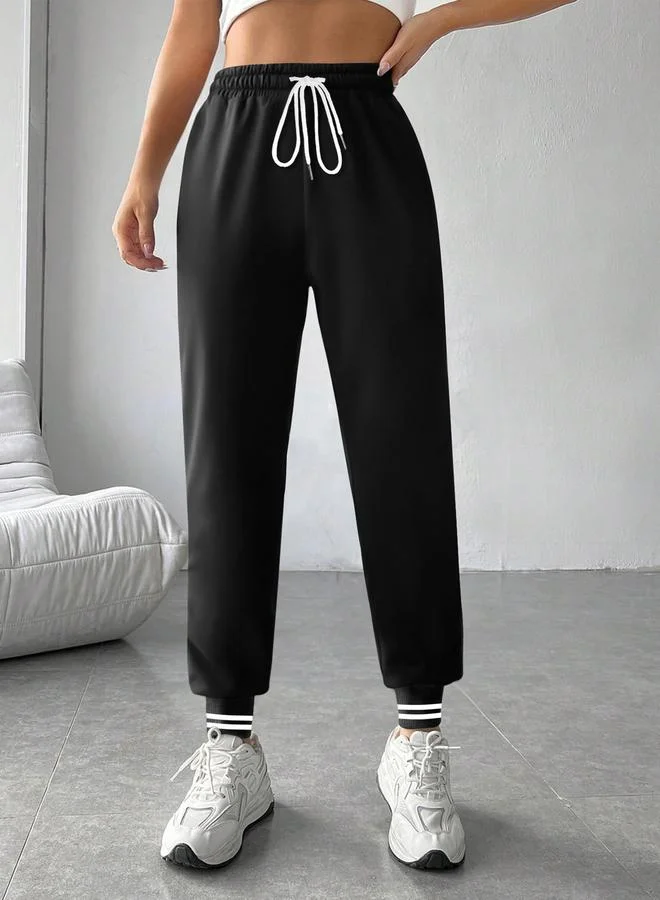 تايك تو بنطلون رياضي أسود سادة بأساور