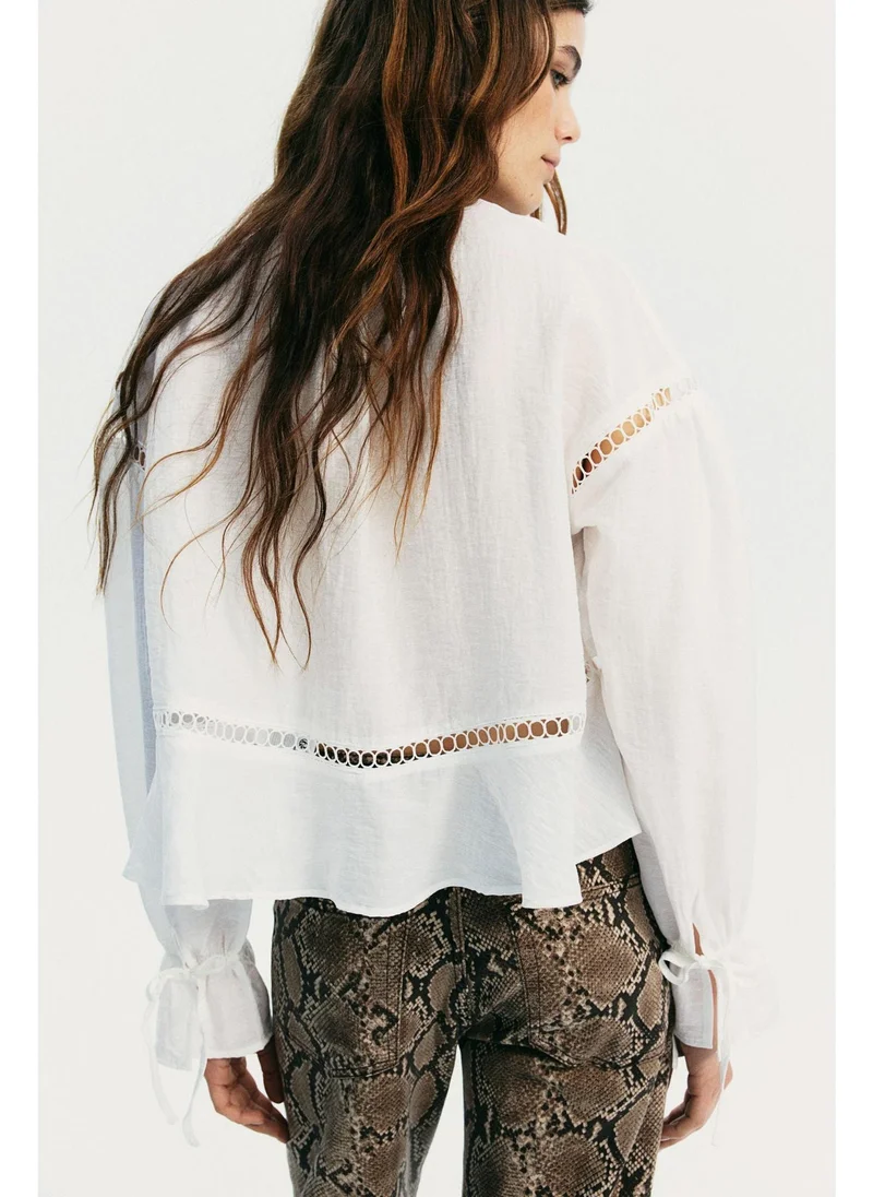 H&M Oversized lace-inset blouse