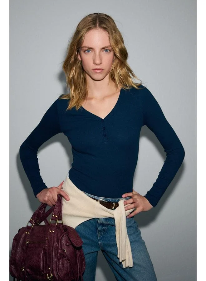 Grimelange KALANI Women's Long Sleeve Snap V-Neck Covered-Button Navy Blouse.