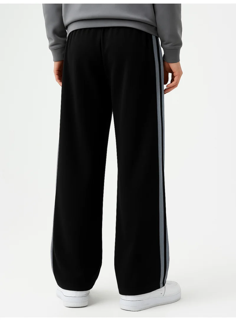 Maniac  Maniac Mens Color Block Black and Light Grey Cotton Baggy Trackpant for Men | Best Price UAE