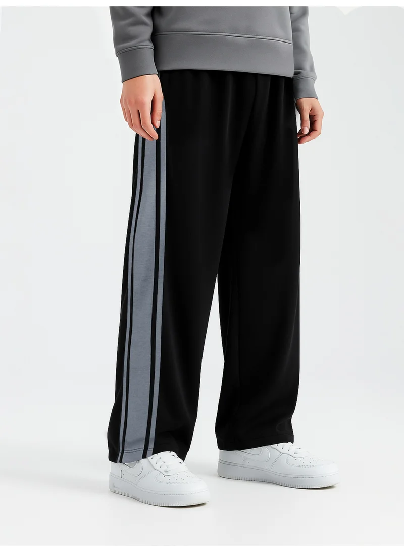 Maniac  Maniac Mens Color Block Black and Light Grey Cotton Baggy Trackpant for Men | Best Price UAE