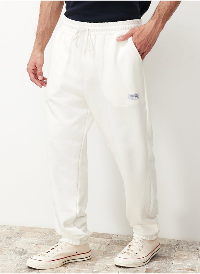 trendyol Ecru Regular Fit Label Appliqued Pockets Stitched Sweatpants TMNSS23EA00010  - Image 1