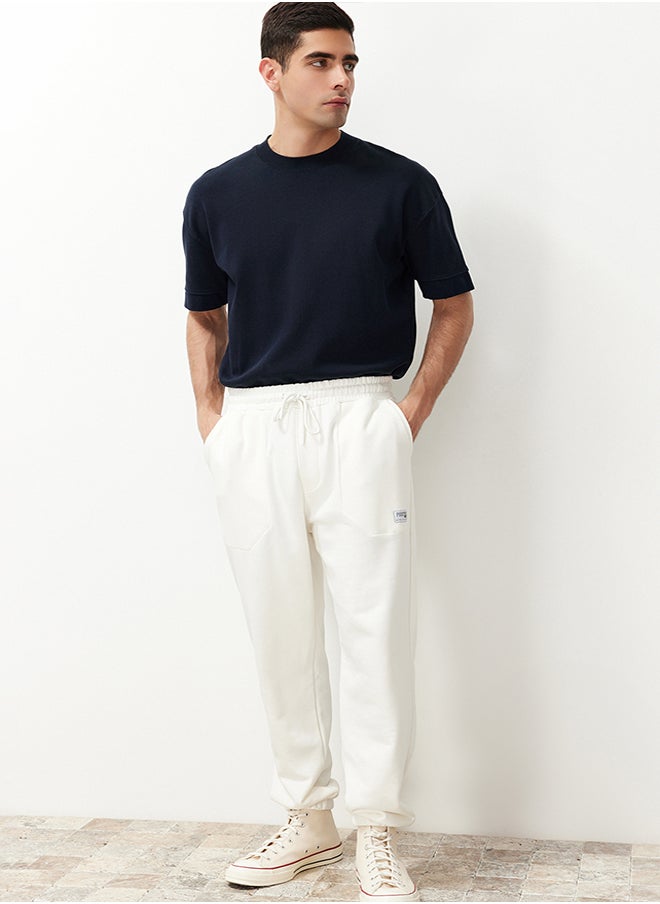 trendyol Ecru Regular Fit Label Appliqued Pockets Stitched Sweatpants TMNSS23EA00010  - Image 4