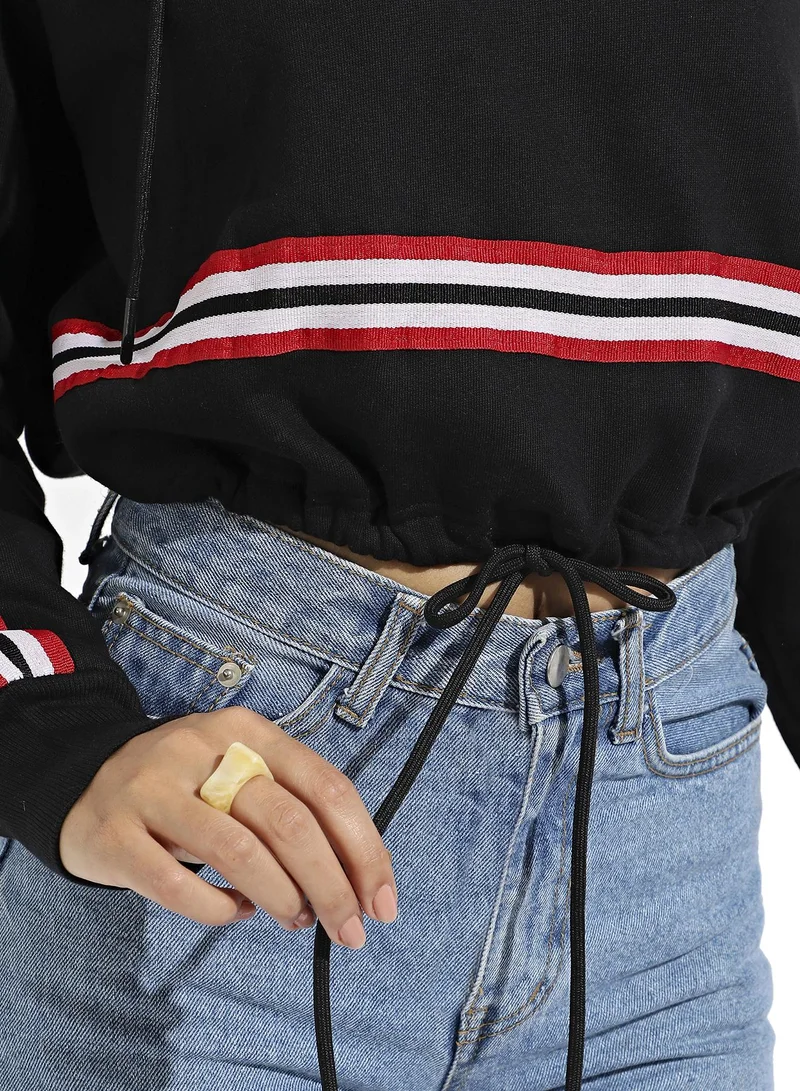 Campus Sutra Women's Black Tie-Up Waist Hoodie With Contrast Striped Sleeves