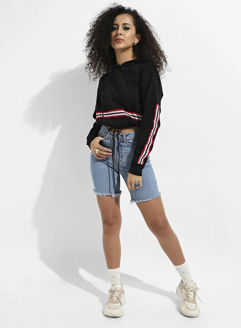 Campus Sutra Women's Black Tie-Up Waist Hoodie With Contrast Striped Sleeves