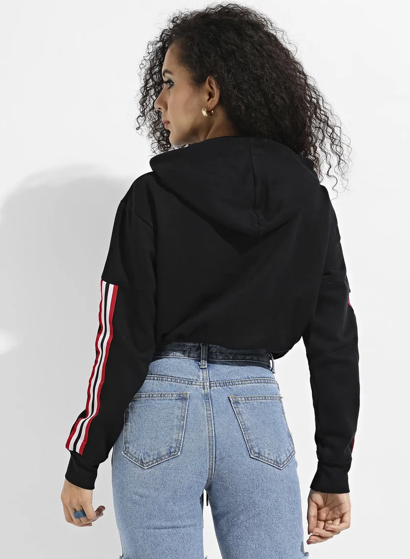 Campus Sutra Women's Black Tie-Up Waist Hoodie With Contrast Striped Sleeves