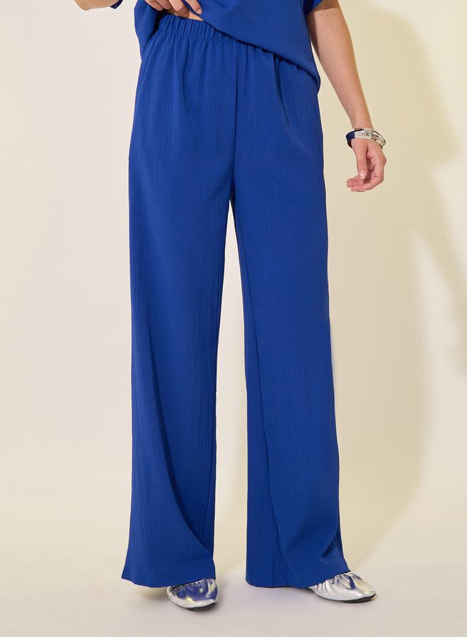 تايك تو طقم تي شيرت وبنطلون سادة بقصة واسعة وياقة دائرية - Image 5