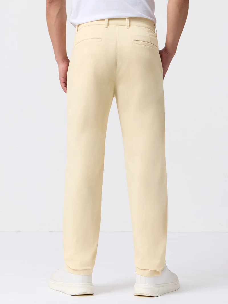 The Souled Store  The Souled Store Chino Pants: Almond Mens and Boys Solid Cotton Twill Spandex Straight Fit Stretch Trousers  | Best Price UAE