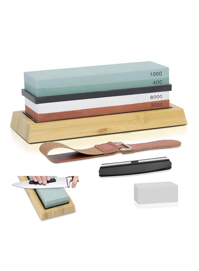 The whetstone set includes two abrasive stones (400/1000 and 3000/8000 grit), a non-slip bamboo base, an angle guide, polishing paste, a leather whetstone belt, and a whetstone leveler. - Image 1
