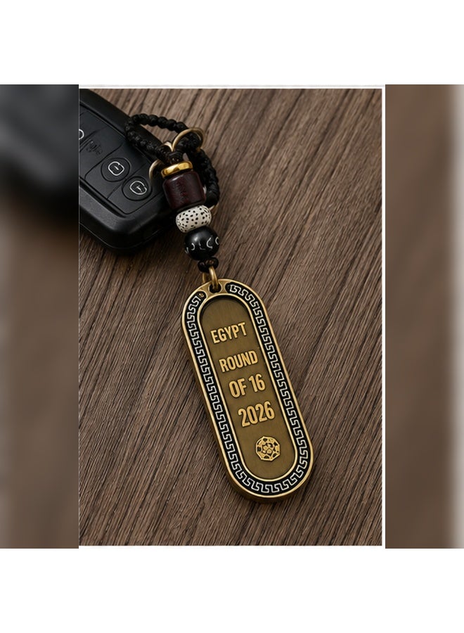 Egypt Round of 16 2026 Commemorative Metal Hanging Keychain with Braided Cord and Decorative Beads, Antique Bronze and Black, 1 Piece - Image 2