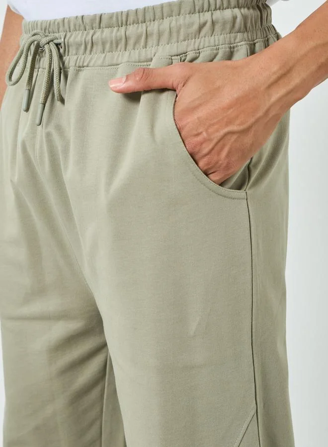 Styli beige Men Beige Solid Drawstring Joggers for Men | Best Price UAE