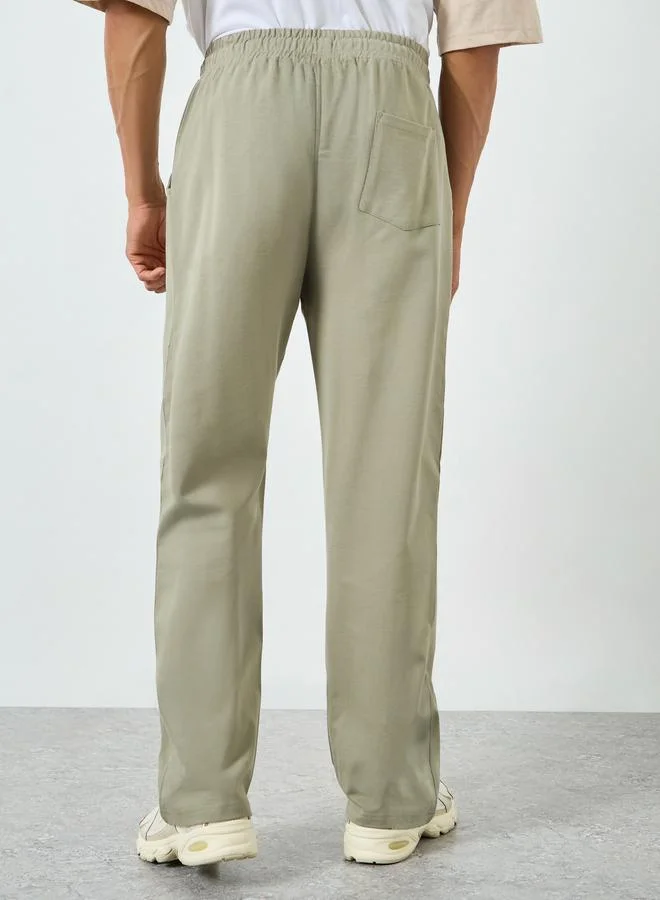 Styli beige Men Beige Solid Drawstring Joggers for Men | Best Price UAE
