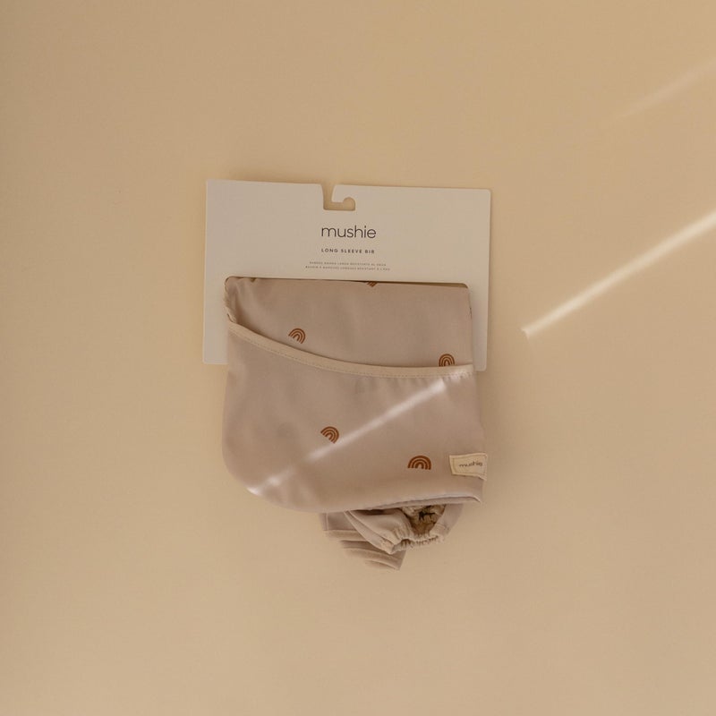 mushie Long Sleeve Baby Bib | Water Resistant Adjustable Fit for Ages 6-24 Months (Rainbows) - Image 2