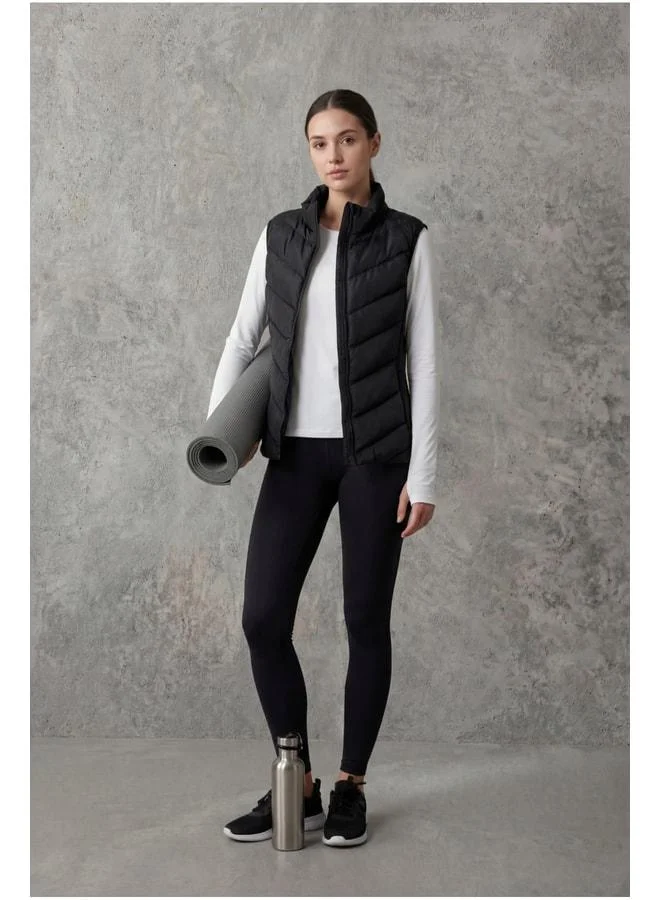 Black Quilted Sleeveless Slim Fit Straight Collar Zipper Pocket Women's Padded Vest.