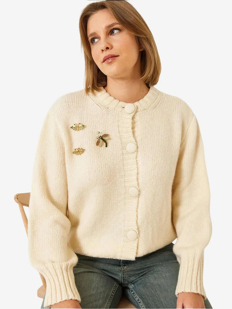 بيانكو لوتشي كارديجان لوكسي محبوك بنقوش مع بوم بوم