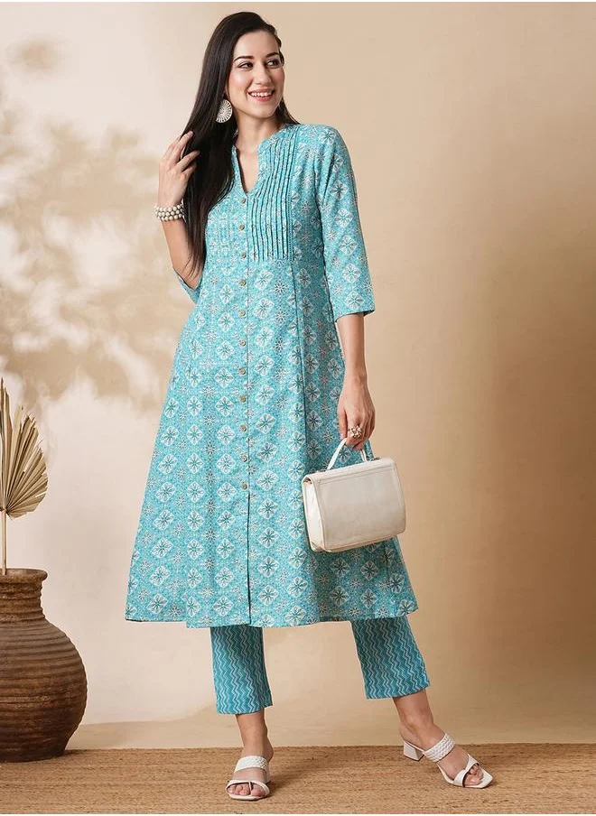 جلو باص Globus Women Blue Mandarin Neck With V Cut Allover Printed Pintuck Detailing A-Line Workwear Kurta With Trousers Set by Styli