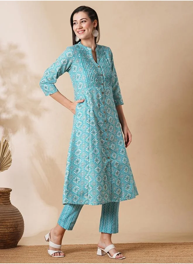 جلو باص Globus Women Blue Mandarin Neck With V Cut Allover Printed Pintuck Detailing A-Line Workwear Kurta With Trousers Set by Styli