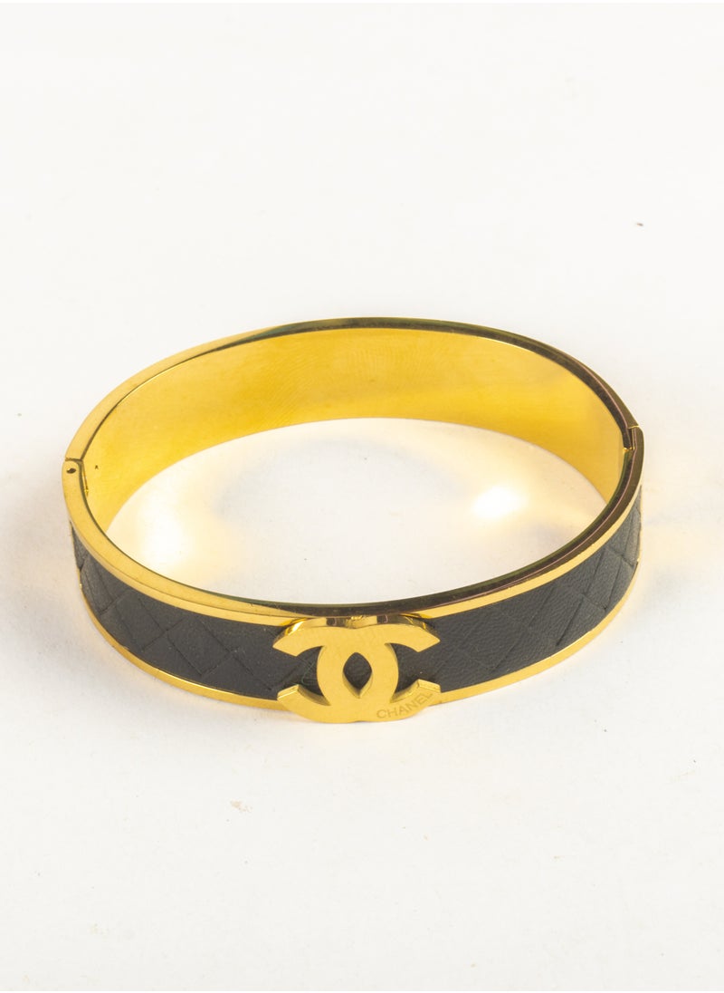 The Black Pearl Accessories - Stainless Steel Golden Bracelet with Black Leather - Image 1