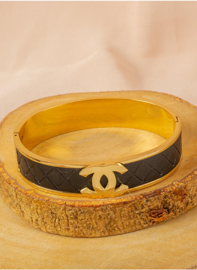 The Black Pearl Accessories - Stainless Steel Golden Bracelet with Black Leather - Image 1