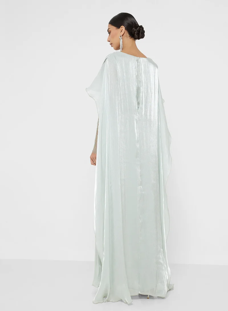 Namshi x Exaggerated Cape Gown With Shimmer Sleeves