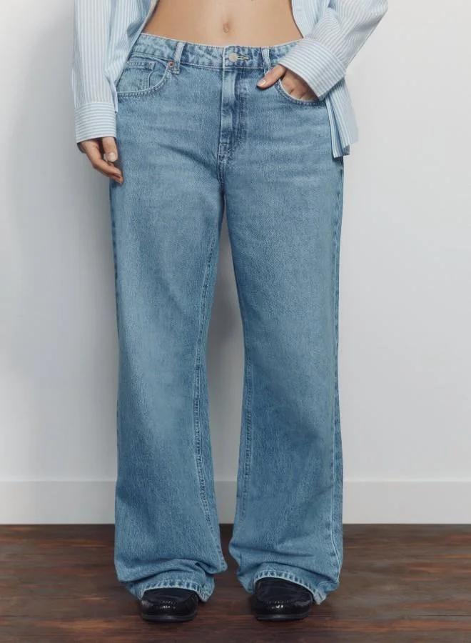 Springfield  High-waisted jeans with front and back pockets, button and zip fastening fastening , and a wide, straight leg. These jeans feature a washing process using cutting-edge technologies, reducing water, chemical, and energy consumption. for Women | Best Price UAE