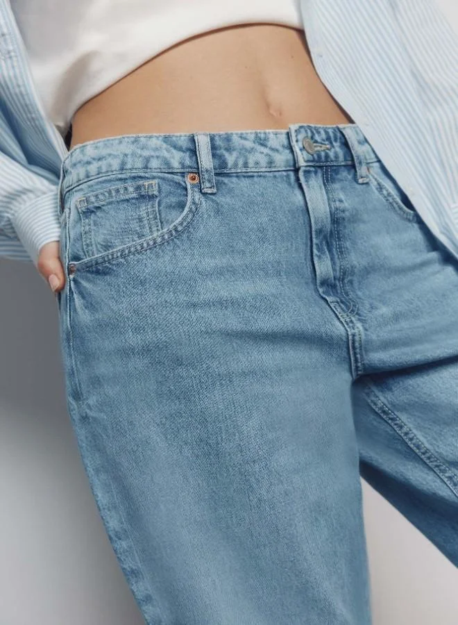 Springfield  High-waisted jeans with front and back pockets, button and zip fastening fastening , and a wide, straight leg. These jeans feature a washing process using cutting-edge technologies, reducing water, chemical, and energy consumption. for Women | Best Price UAE