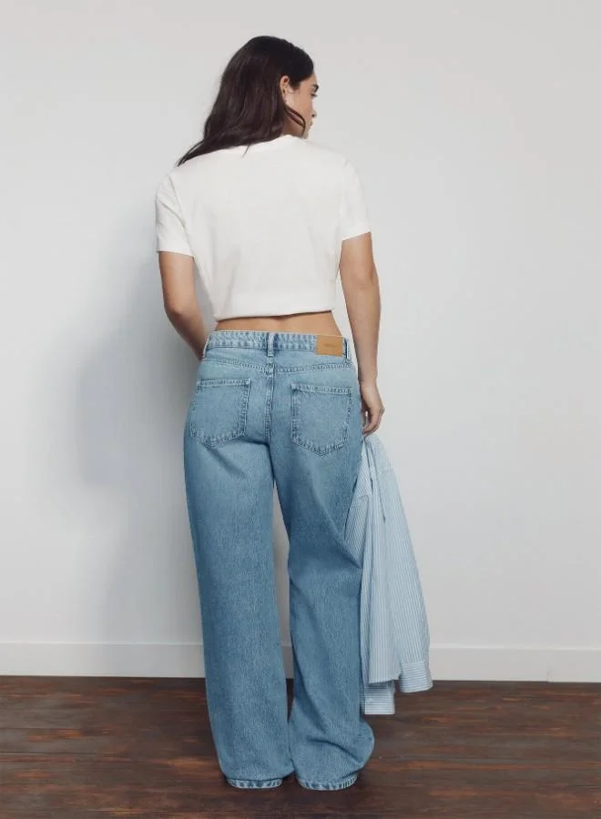 Springfield  High-waisted jeans with front and back pockets, button and zip fastening fastening , and a wide, straight leg. These jeans feature a washing process using cutting-edge technologies, reducing water, chemical, and energy consumption. for Women | Best Price UAE