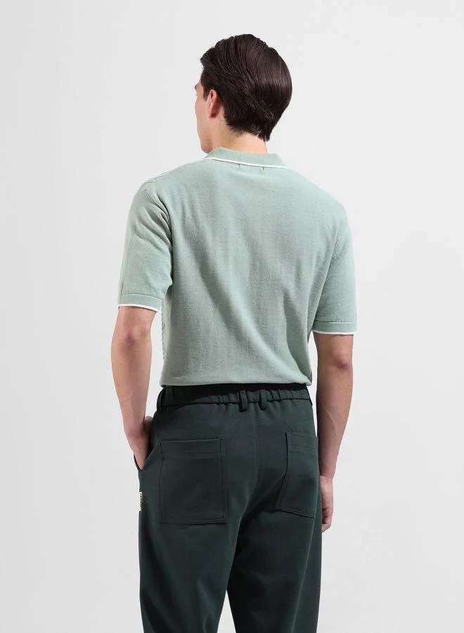 شركة المرآب الهندية Men Slim Fit Textured Polo Neck Half Sleeves T-Shirt