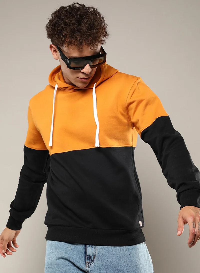 Campus Sutra Men's Black & Mustard Yellow Pullover Hoodie With Ribbed Hem For Casual Wear | Hooded Neck | Long Sleeve | Pull On Closure | Cotton Sweatshirt Crafted With Comfort Fit For Everyday Wear