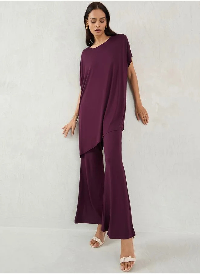 Femmella Mid Rise Knit Flared Pants by Styli