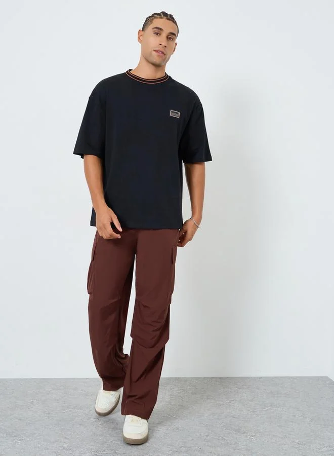 Styli Men Black Oversized Chest Patch T-Shirt