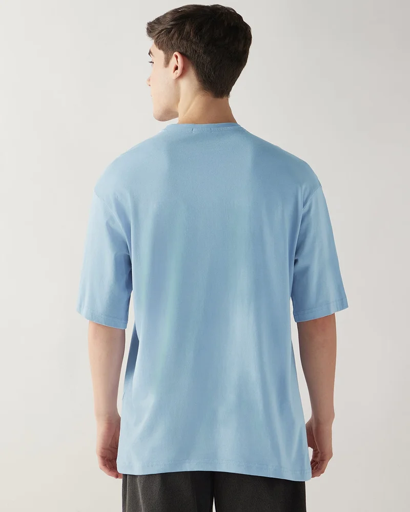 bewakoof  Men's Chambray Blue Boring Typography Oversized T-shirt  | Best Price UAE