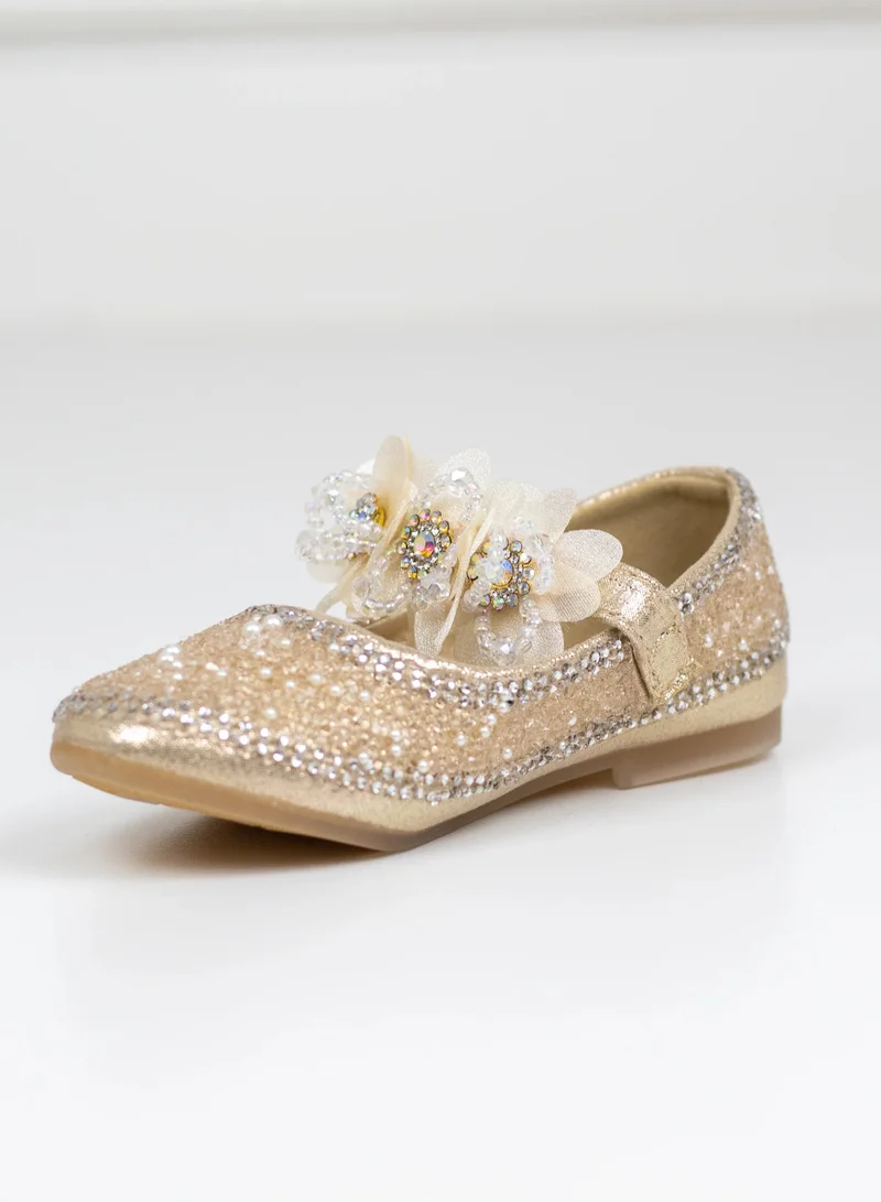 LAMARAPARIS AMOLI INFANT GIRLS GOLD DIAMANTE UPPER PUMP WITH FLOWER BELT