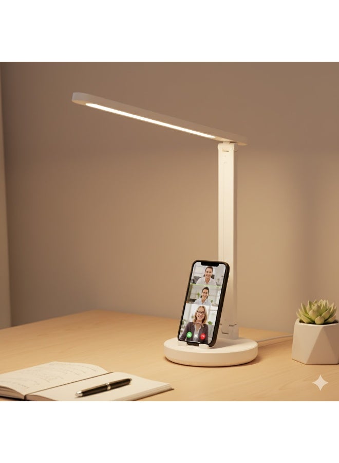 A touch-sensitive desk lamp with a mobile phone holder; provides bright lighting for home or office. - Image 1