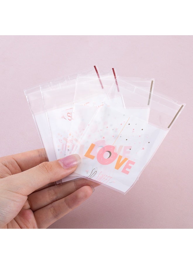 سيستار عبوة من 100 كيس قابلة لإعادة الإغلاق - أكياس هدايا مزخرفة مقاس 7 سم × 10 سم للحلوى والبسكويت والمعجنات (آمنة غذائيًا وقابلة لإعادة الاستخدام) - Image 2