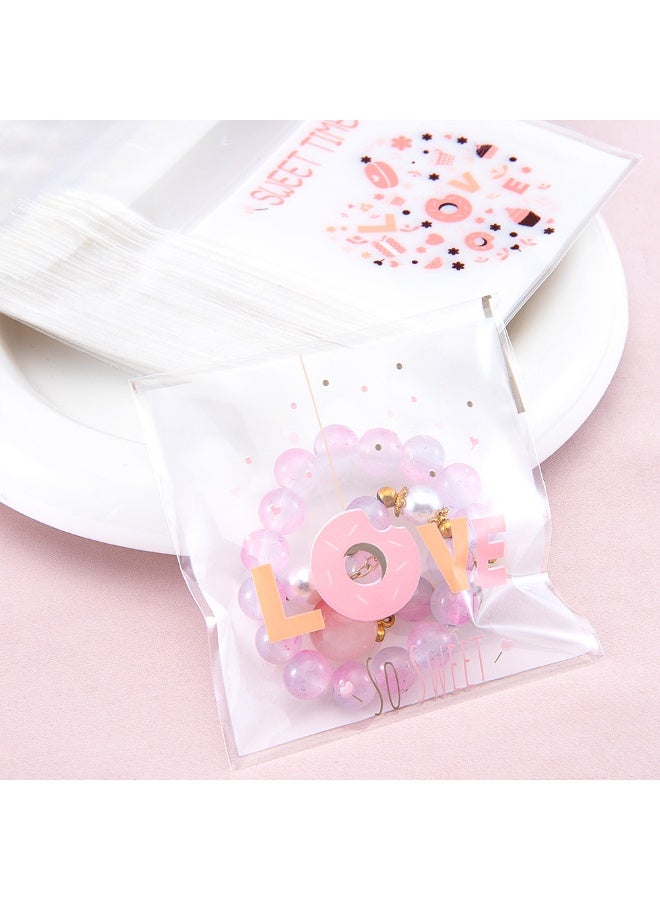 سيستار عبوة من 100 كيس قابلة لإعادة الإغلاق - أكياس هدايا مزخرفة مقاس 7 سم × 10 سم للحلوى والبسكويت والمعجنات (آمنة غذائيًا وقابلة لإعادة الاستخدام) - Image 4