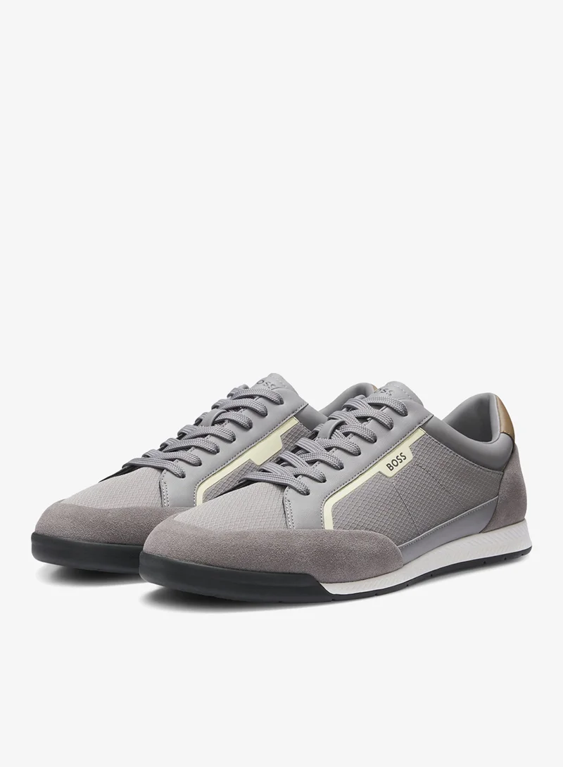 Mixed-material trainers with stitched detailing