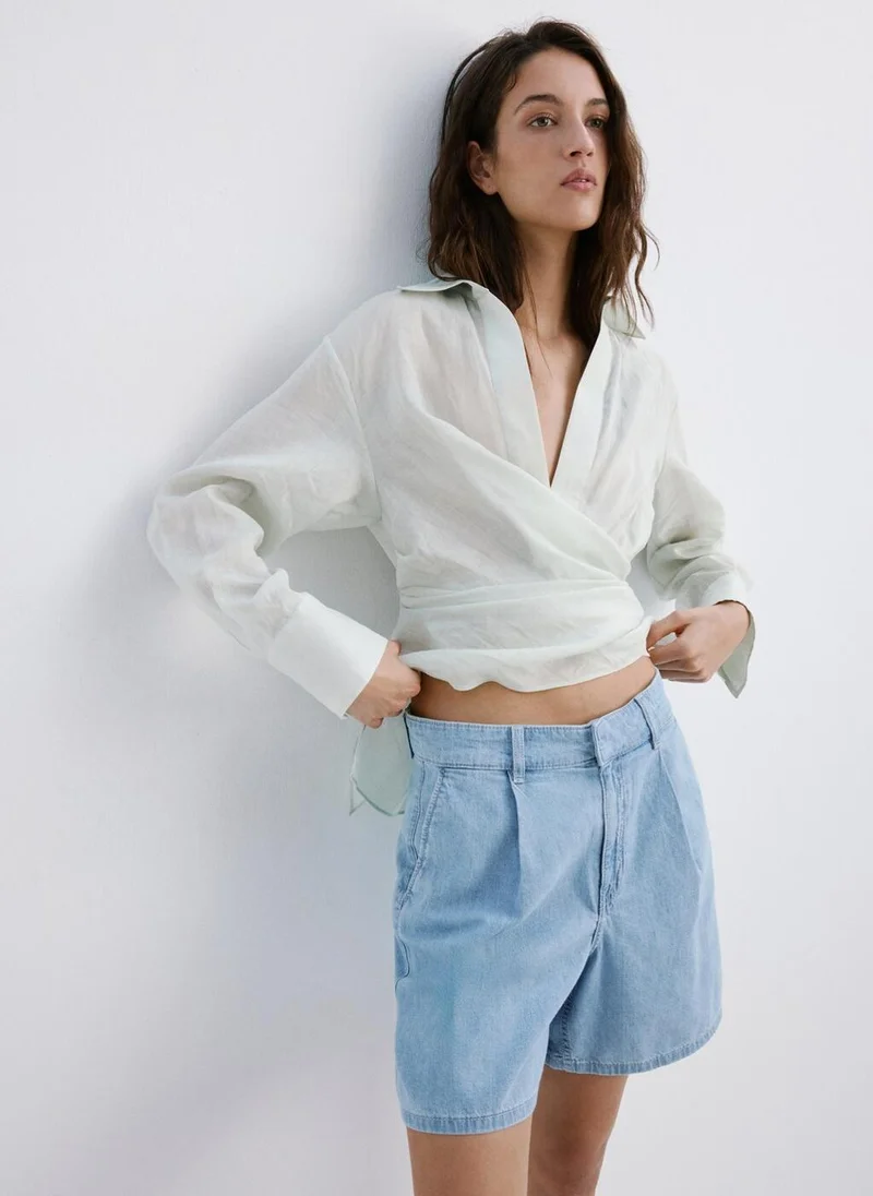Mid-rise denim bermuda shorts with pleats