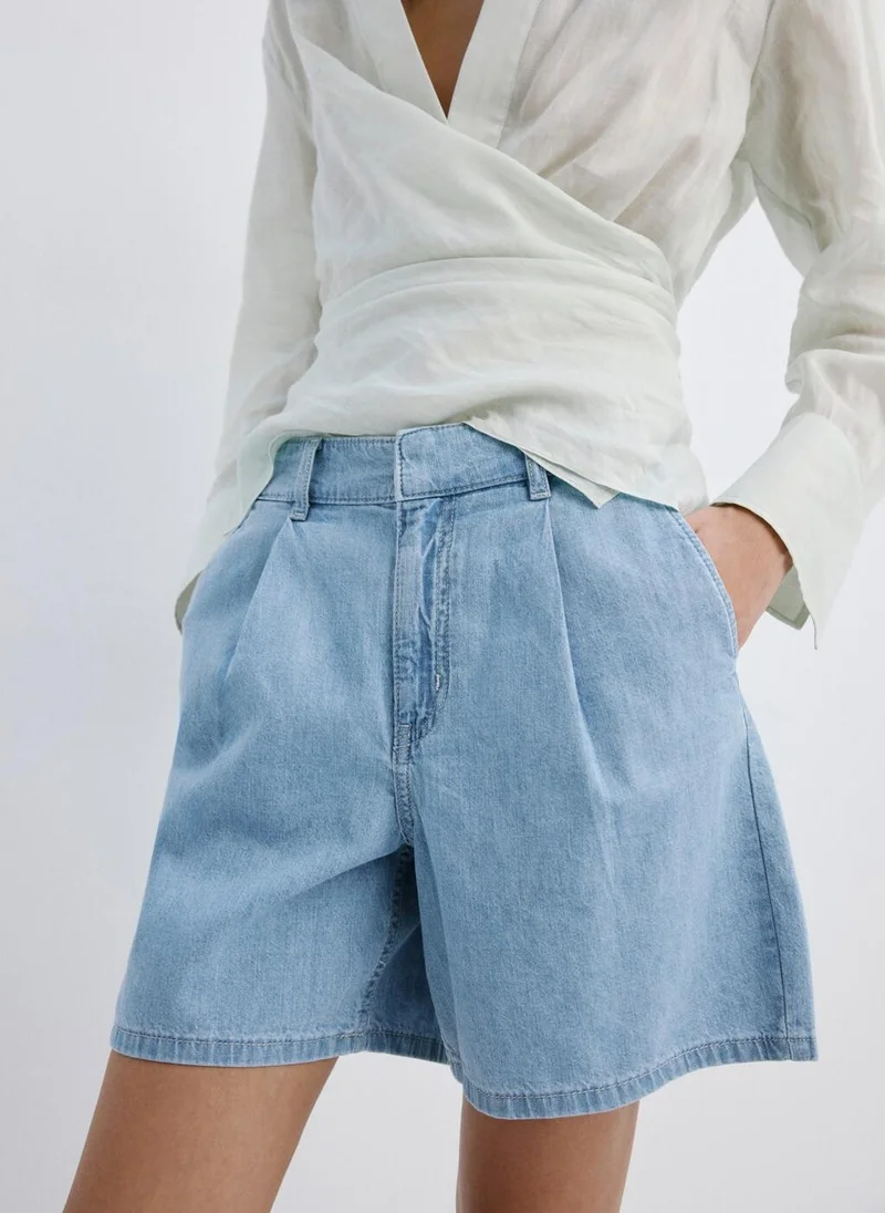 MANGO  Mid-rise denim bermuda shorts with pleats for Women | Best Price UAE