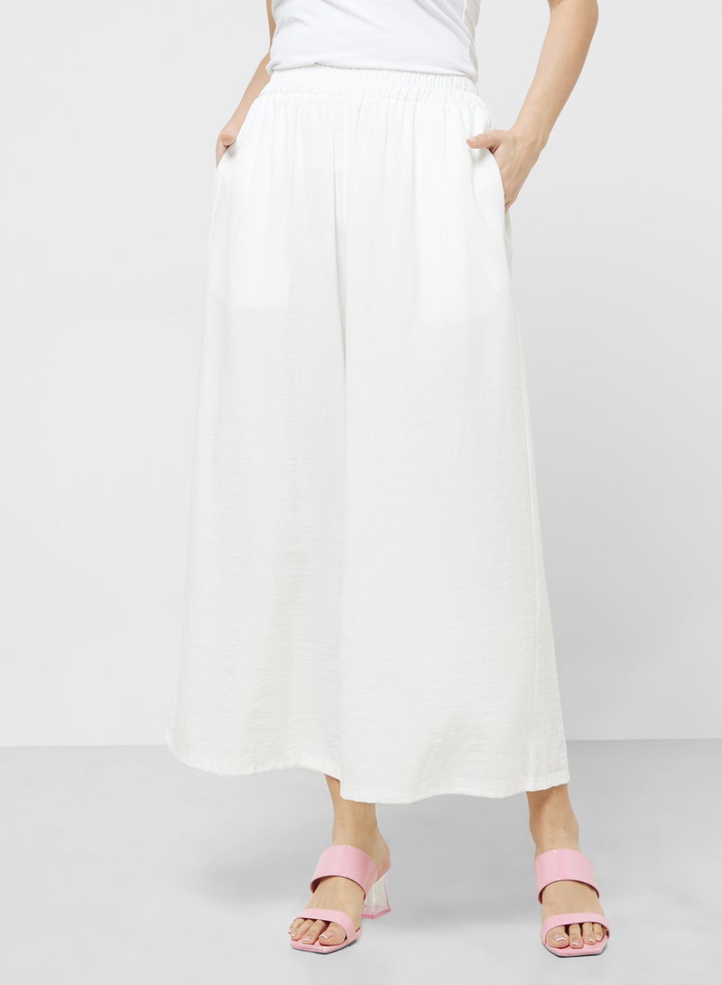 خزانة طقم قميص بأزرار وبنطلون واسع - Image 4