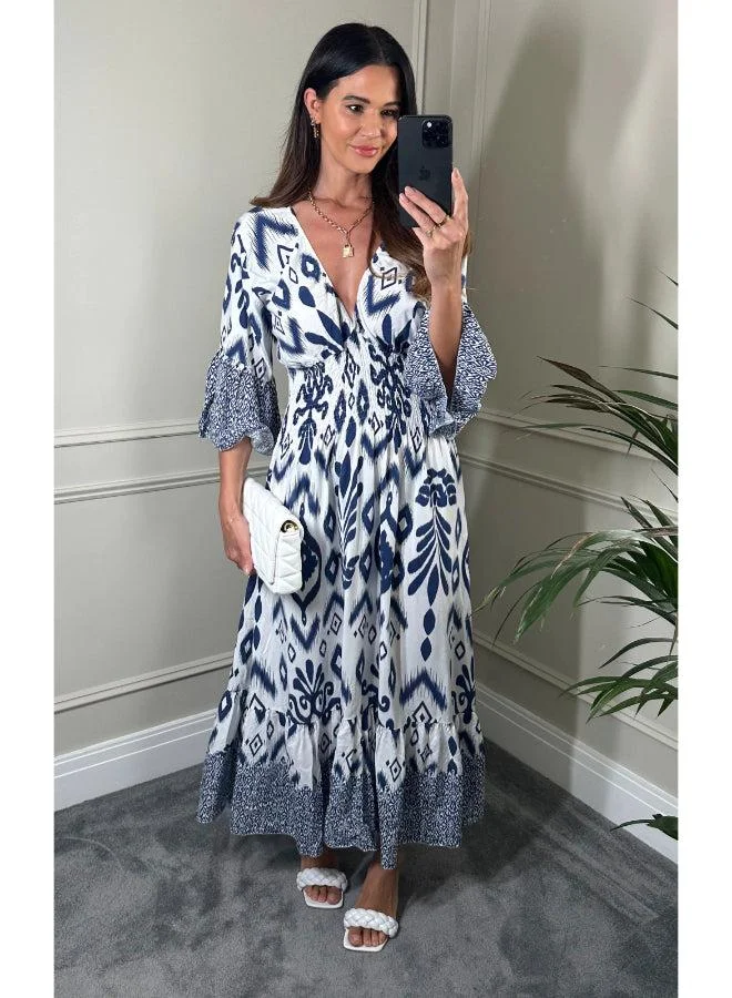 Hoxton Gal Navy & White Geometric Print Maxi Dress V‑Neck, Flutter Sleeves and Shirred Waist