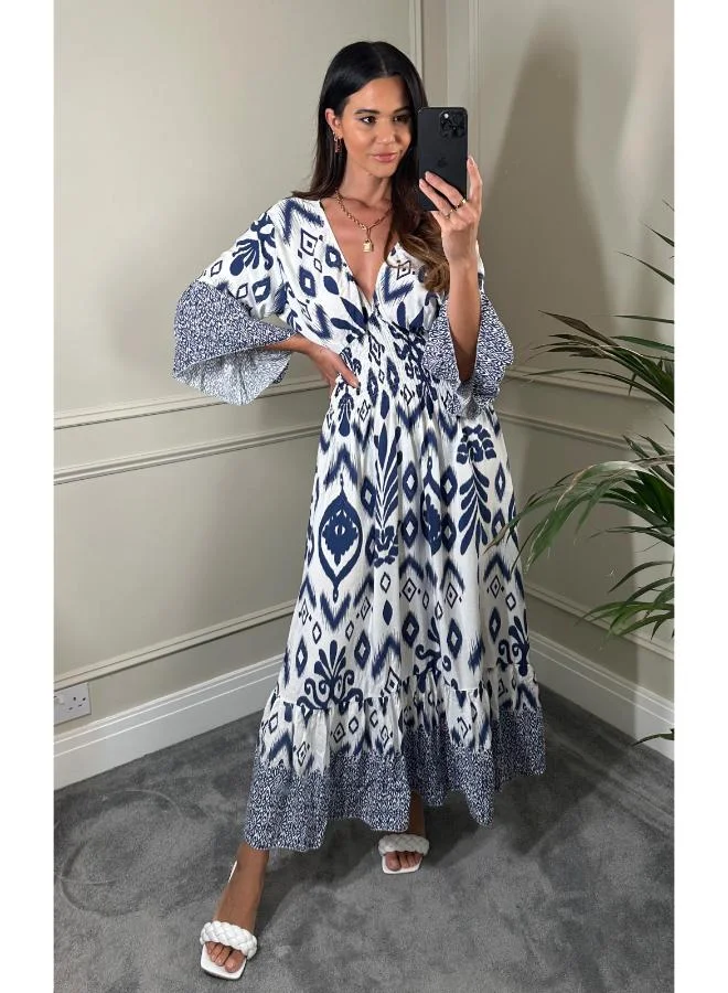 Hoxton Gal Navy & White Geometric Print Maxi Dress V‑Neck, Flutter Sleeves and Shirred Waist